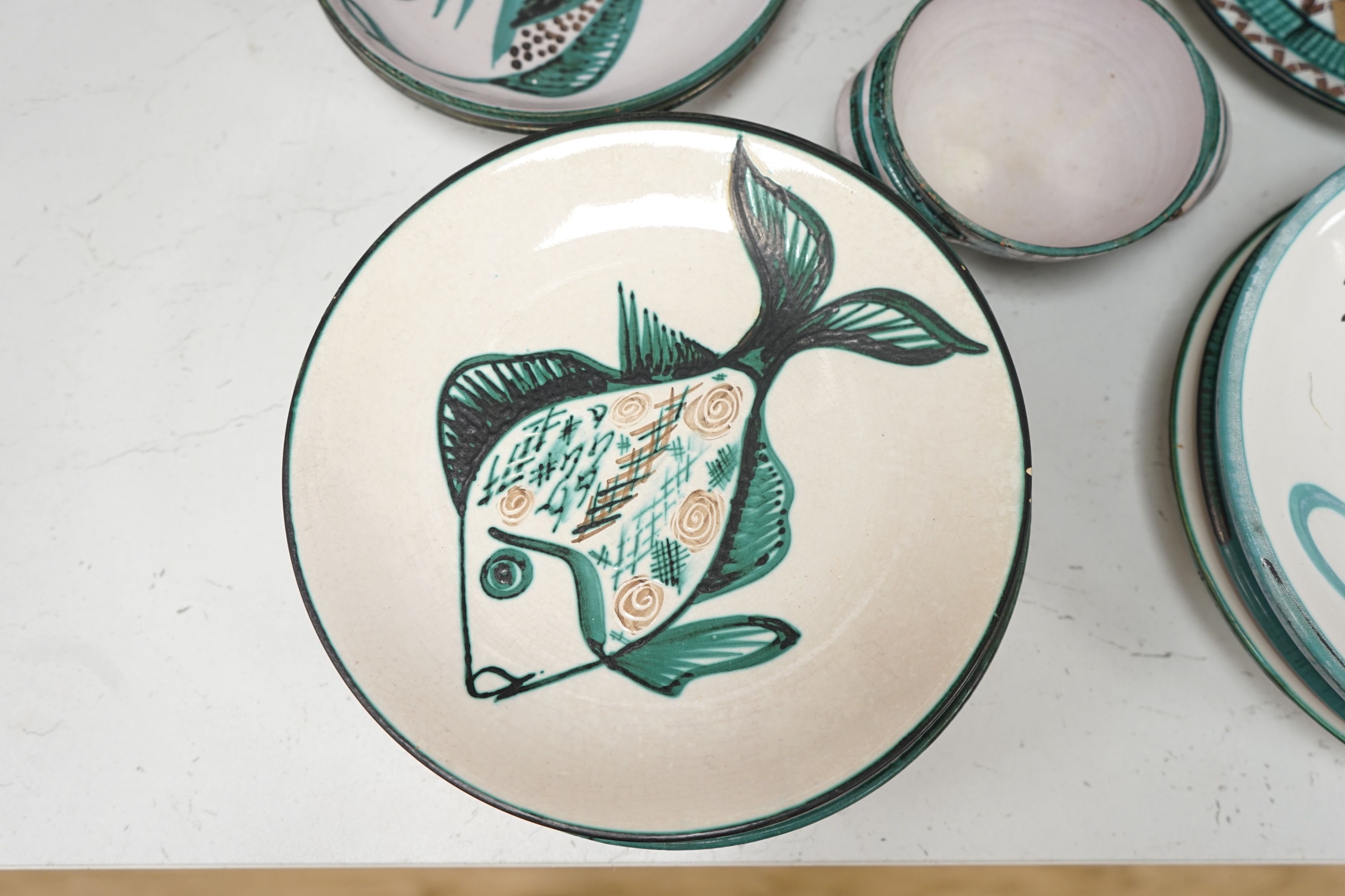 A mixed collection fish and flower designed French pottery dinnerware by Robert Picault, dishes 23cm diameter. Condition - variable